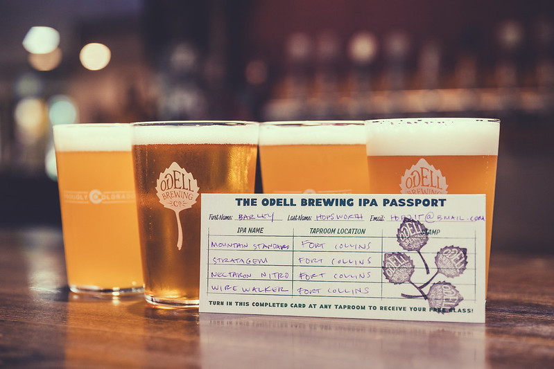 four beer pints pictured next to the paper passport