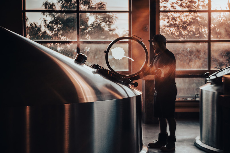 brewer looking into tank